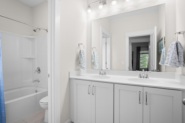 full bathroom featuring shower / bathtub combination with curtain, tile patterned floors, vanity, and toilet