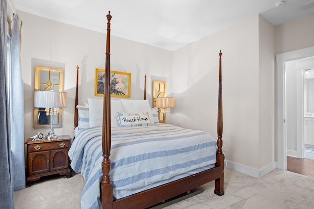 bedroom with light colored carpet