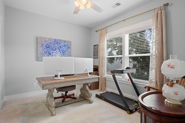 carpeted office featuring ceiling fan