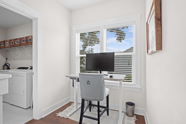 office with wood-type flooring, washer / dryer, and plenty of natural light