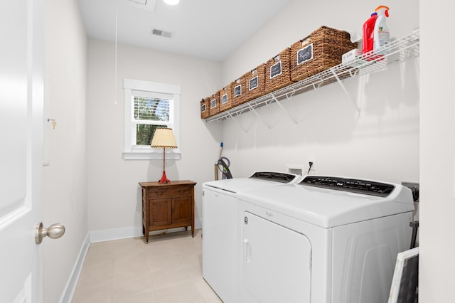 clothes washing area with washing machine and clothes dryer