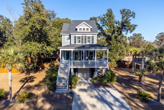 view of front of house with a garage and covered porch