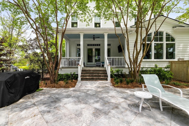11 Dalton St, Daniel Island, SC 29492 - view of front facade with fence, covered porch, and french doors