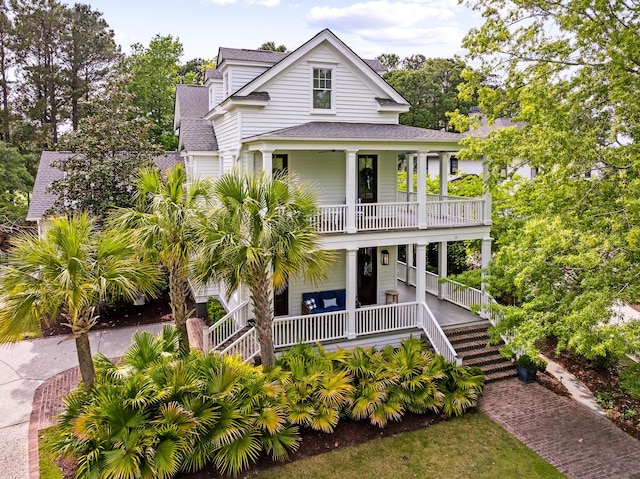 11 Dalton St, Daniel Island, SC 29492 - view of front of property with covered porch, a shingled roof, a balcony, and stairs