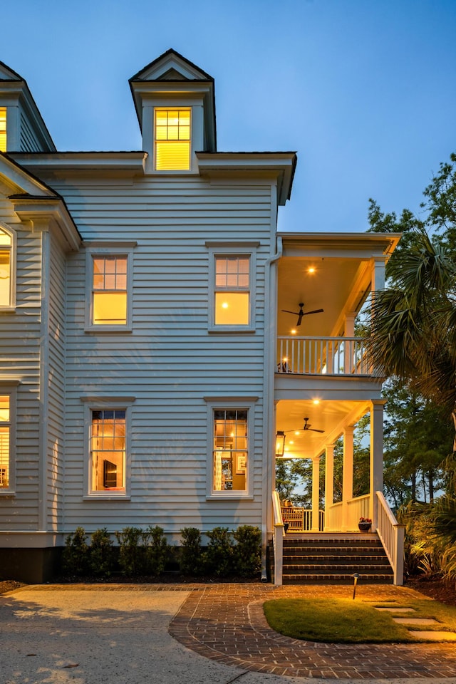 11 Dalton St, Daniel Island, SC 29492 - view of front of home featuring a balcony, ceiling fan, and a porch