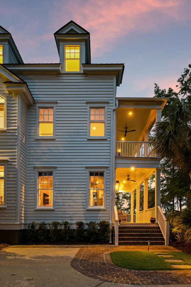 11 Dalton St, Daniel Island, SC 29492 - back of house at dusk with a balcony and a porch