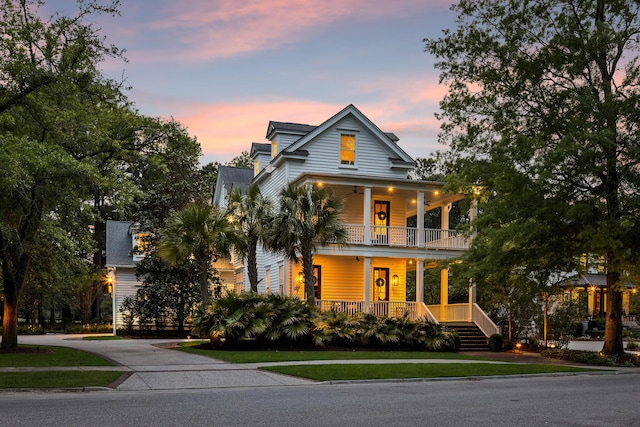 11 Dalton St, Daniel Island, SC 29492 - view of front of property featuring a balcony, a porch, and a front yard