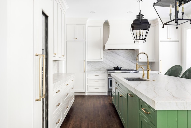11 Dalton St, Daniel Island, SC 29492 - kitchen with green cabinetry, a chandelier, white cabinetry, a sink, and dark wood-style flooring