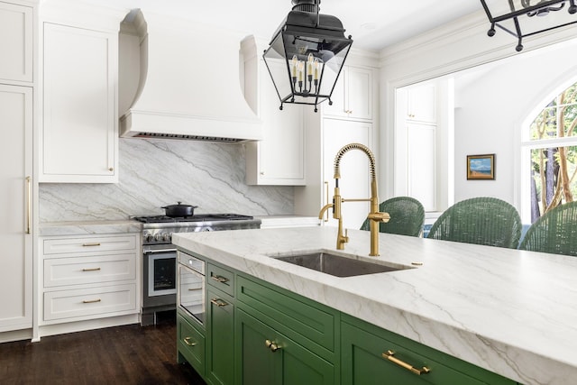 11 Dalton St, Daniel Island, SC 29492 - kitchen featuring green cabinets, premium range hood, a sink, stainless steel stove, and tasteful backsplash
