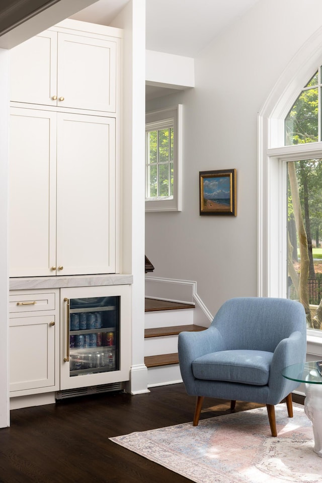 11 Dalton St, Daniel Island, SC 29492 - living area featuring beverage cooler, dark wood finished floors, and stairs