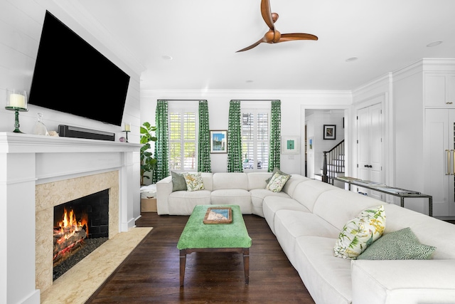 11 Dalton St, Daniel Island, SC 29492 - living room with a premium fireplace, ornamental molding, dark wood finished floors, ceiling fan, and stairway