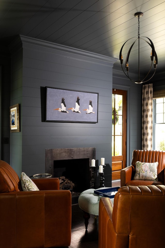11 Dalton St, Daniel Island, SC 29492 - living room featuring crown molding, a premium fireplace, and wood walls