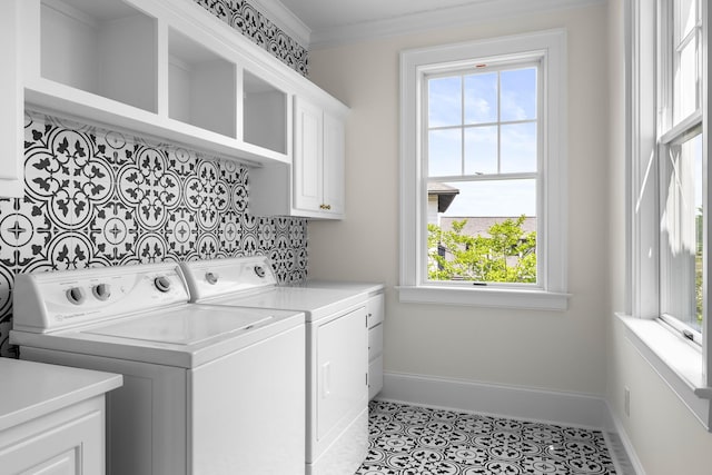 11 Dalton St, Daniel Island, SC 29492 - washroom featuring washer and clothes dryer, cabinet space, baseboards, tile patterned flooring, and crown molding