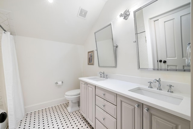 11 Dalton St, Daniel Island, SC 29492 - bathroom featuring vaulted ceiling, baseboards, toilet, and double vanity