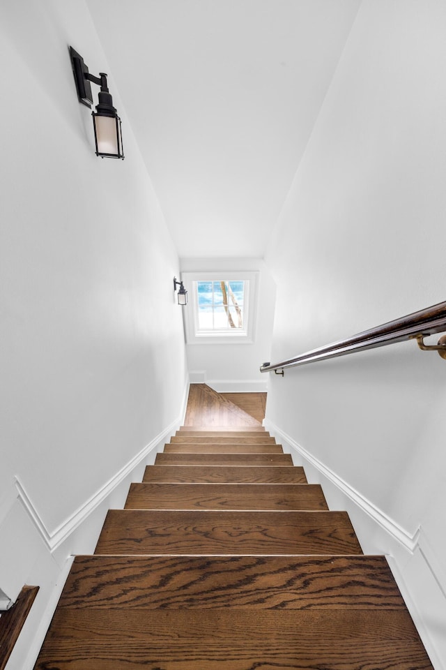 11 Dalton St, Daniel Island, SC 29492 - staircase featuring vaulted ceiling, wood finished floors, and baseboards
