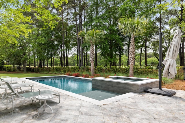11 Dalton St, Daniel Island, SC 29492 - view of swimming pool featuring an in-ground hot tub, a patio area, and view of wooded area