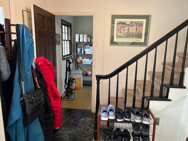 foyer featuring stairs