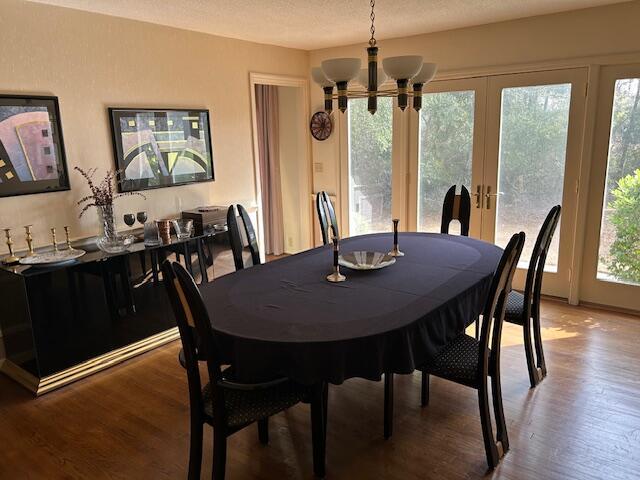 dining room featuring a notable chandelier and wood finished floors