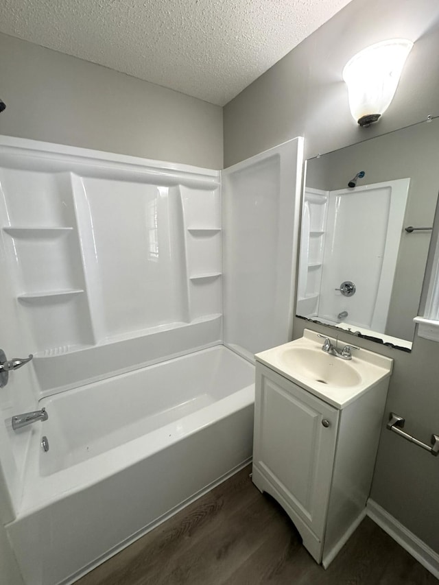 36 Guerry Cir, Goose Creek, SC 29445 - bathroom with wood finished floors, a textured ceiling, vanity, and  shower combination