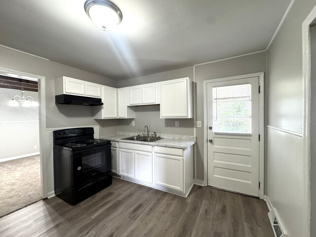 36 Guerry Cir, Goose Creek, SC 29445 - kitchen with black range with electric cooktop, a sink, white cabinetry, and light countertops
