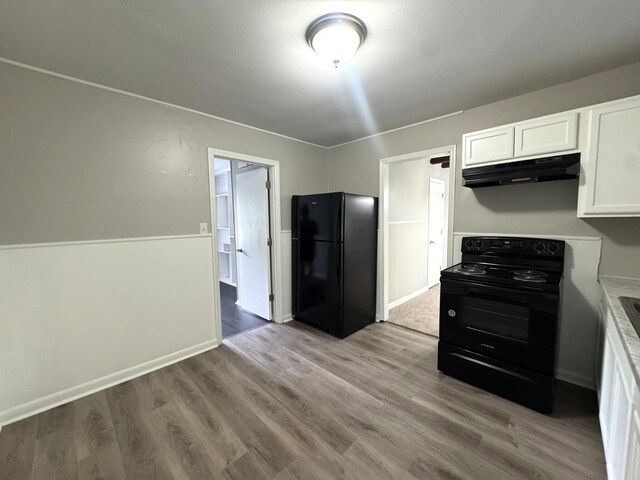 36 Guerry Cir, Goose Creek, SC 29445 - kitchen featuring black appliances, under cabinet range hood, white cabinetry, wood finished floors, and light countertops
