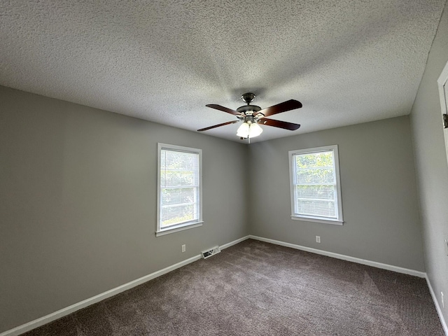 36 Guerry Cir, Goose Creek, SC 29445 - unfurnished room featuring ceiling fan, dark carpet, baseboards, and a textured ceiling