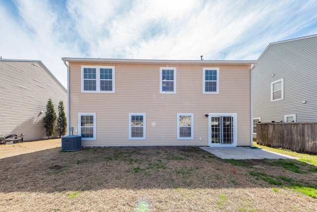 back of house featuring central AC, a patio area, and fence