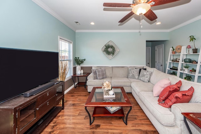 living area with crown molding, recessed lighting, visible vents, a ceiling fan, and wood finished floors