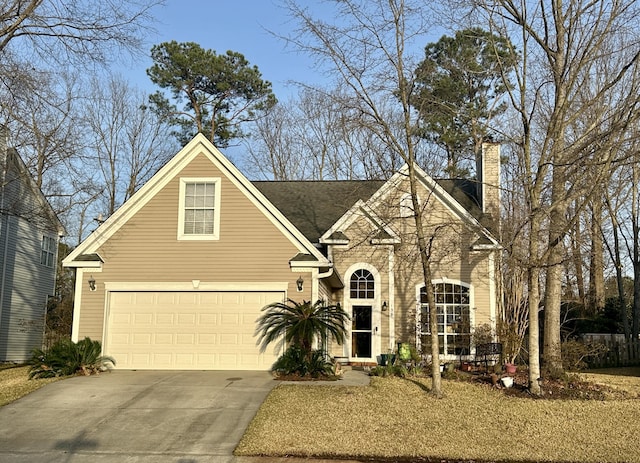 traditional-style home with concrete driveway and a chimney