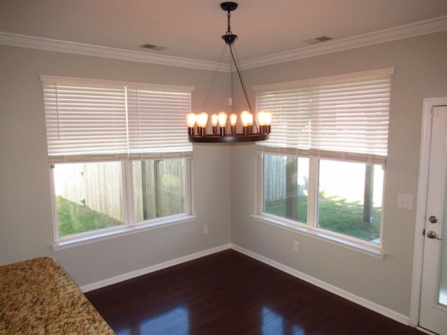 unfurnished dining area with crown molding, a chandelier, plenty of natural light, and dark hardwood / wood-style flooring