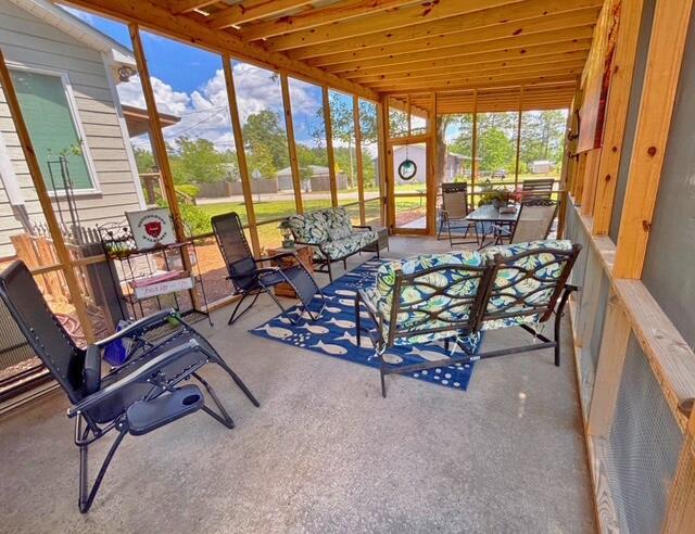 sunroom featuring an outdoor living space