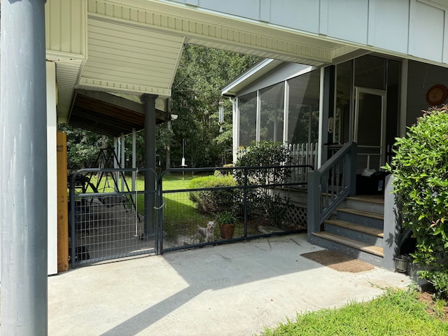 view of gate featuring a patio area