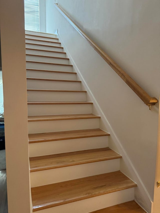 stairway with wood-type flooring