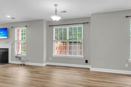 350 Cypress Walk Way, Wando, SC 29492 - unfurnished living room featuring wood finished floors, a fireplace, and recessed lighting