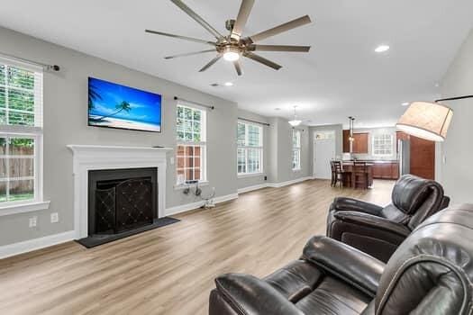 350 Cypress Walk Way, Wando, SC 29492 - living area featuring ceiling fan, light wood-type flooring, a fireplace, and recessed lighting
