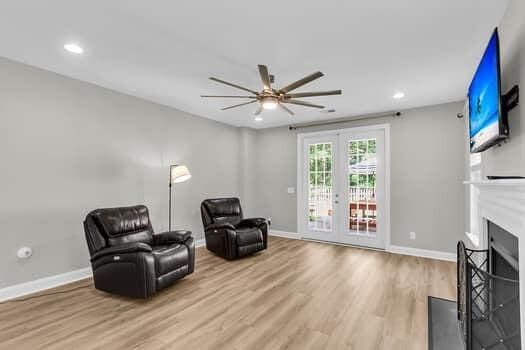 350 Cypress Walk Way, Wando, SC 29492 - living area with ceiling fan, french doors, wood finished floors, recessed lighting, and a fireplace