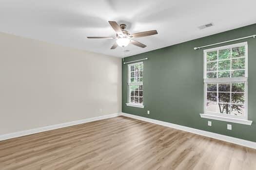 350 Cypress Walk Way, Wando, SC 29492 - unfurnished room featuring plenty of natural light, ceiling fan, and wood finished floors