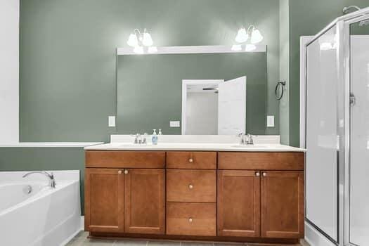 350 Cypress Walk Way, Wando, SC 29492 - full bathroom featuring double vanity, a bath, and a shower stall