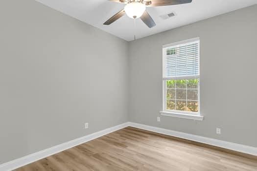 350 Cypress Walk Way, Wando, SC 29492 - unfurnished room with wood finished floors and a ceiling fan