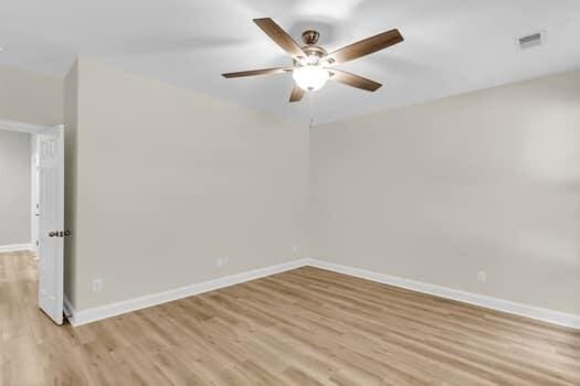 350 Cypress Walk Way, Wando, SC 29492 - empty room with light wood-style flooring and ceiling fan