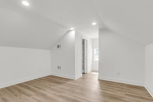 350 Cypress Walk Way, Wando, SC 29492 - additional living space with lofted ceiling, wood finished floors, and recessed lighting