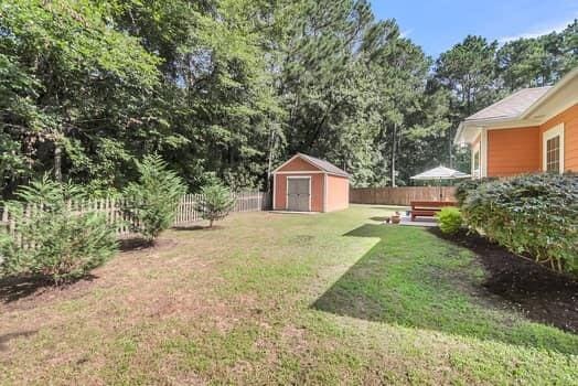 350 Cypress Walk Way, Wando, SC 29492 - fenced backyard featuring a storage shed