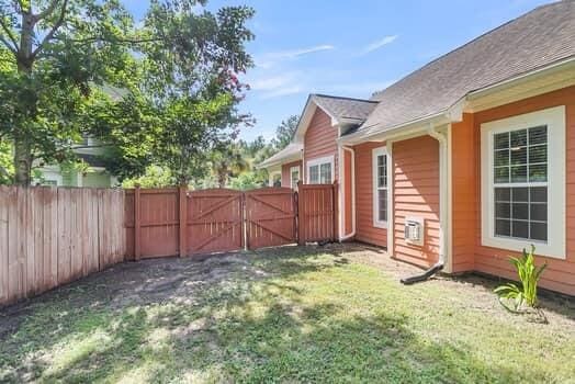 350 Cypress Walk Way, Wando, SC 29492 - fenced backyard with a gate