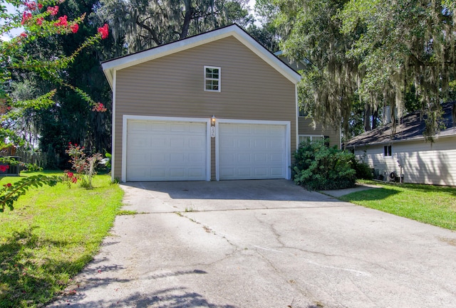 garage featuring a lawn