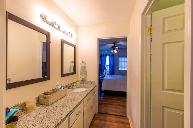 bathroom featuring vanity, hardwood / wood-style flooring, and ceiling fan