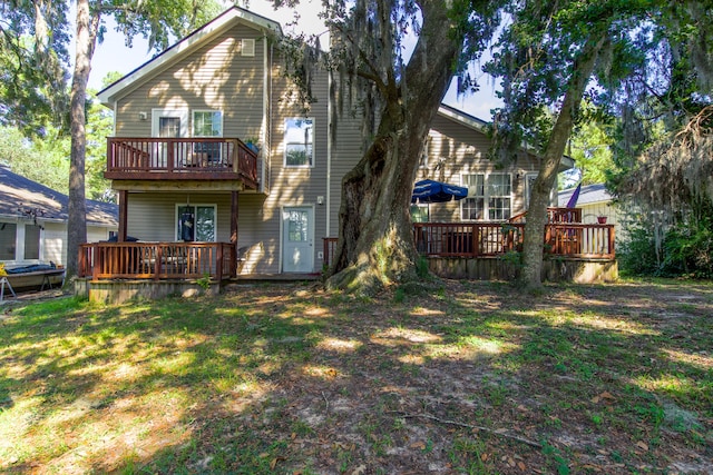 back of property with a wooden deck