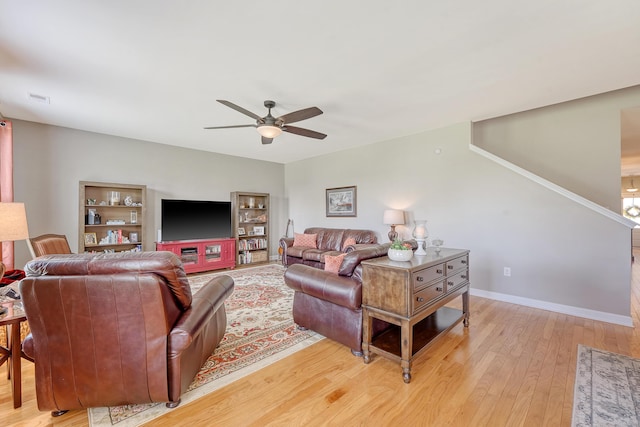 109 Cypress Plantation Rd, Moncks Corner, SC 29461 - living area with a ceiling fan, light wood-style floors, and stairs