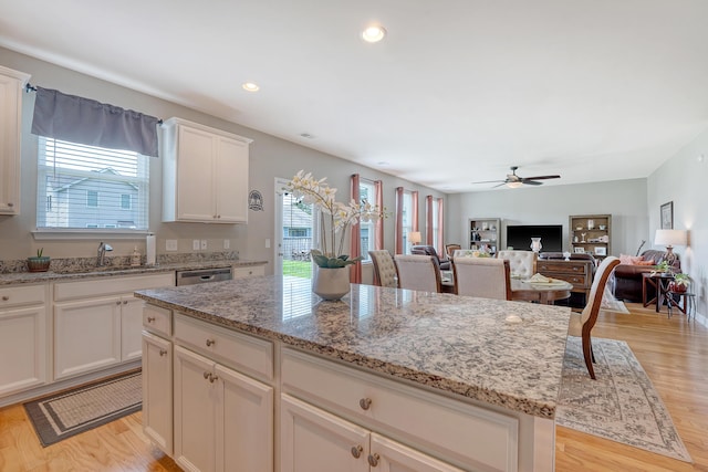 109 Cypress Plantation Rd, Moncks Corner, SC 29461 - kitchen featuring healthy amount of natural light, a ceiling fan, light stone counters, light wood-style floors, and recessed lighting