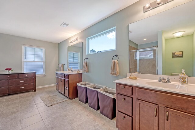 109 Cypress Plantation Rd, Moncks Corner, SC 29461 - full bathroom featuring a stall shower, two vanities, tile patterned flooring, and a tub to relax in