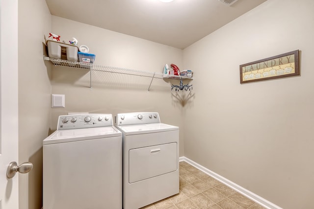 109 Cypress Plantation Rd, Moncks Corner, SC 29461 - laundry room with washing machine and dryer and light tile patterned floors
